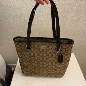 Authentic Coach purse with logos in brown